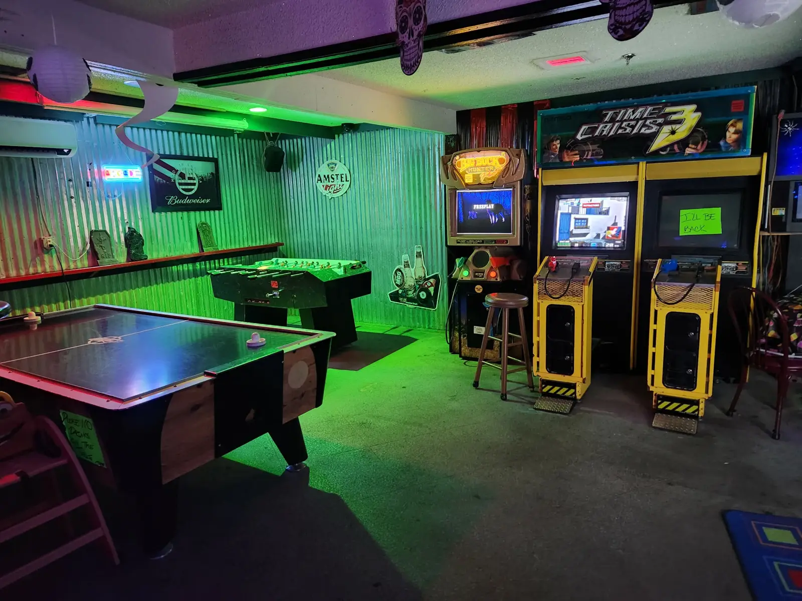 Air hockey and foosball in the game room