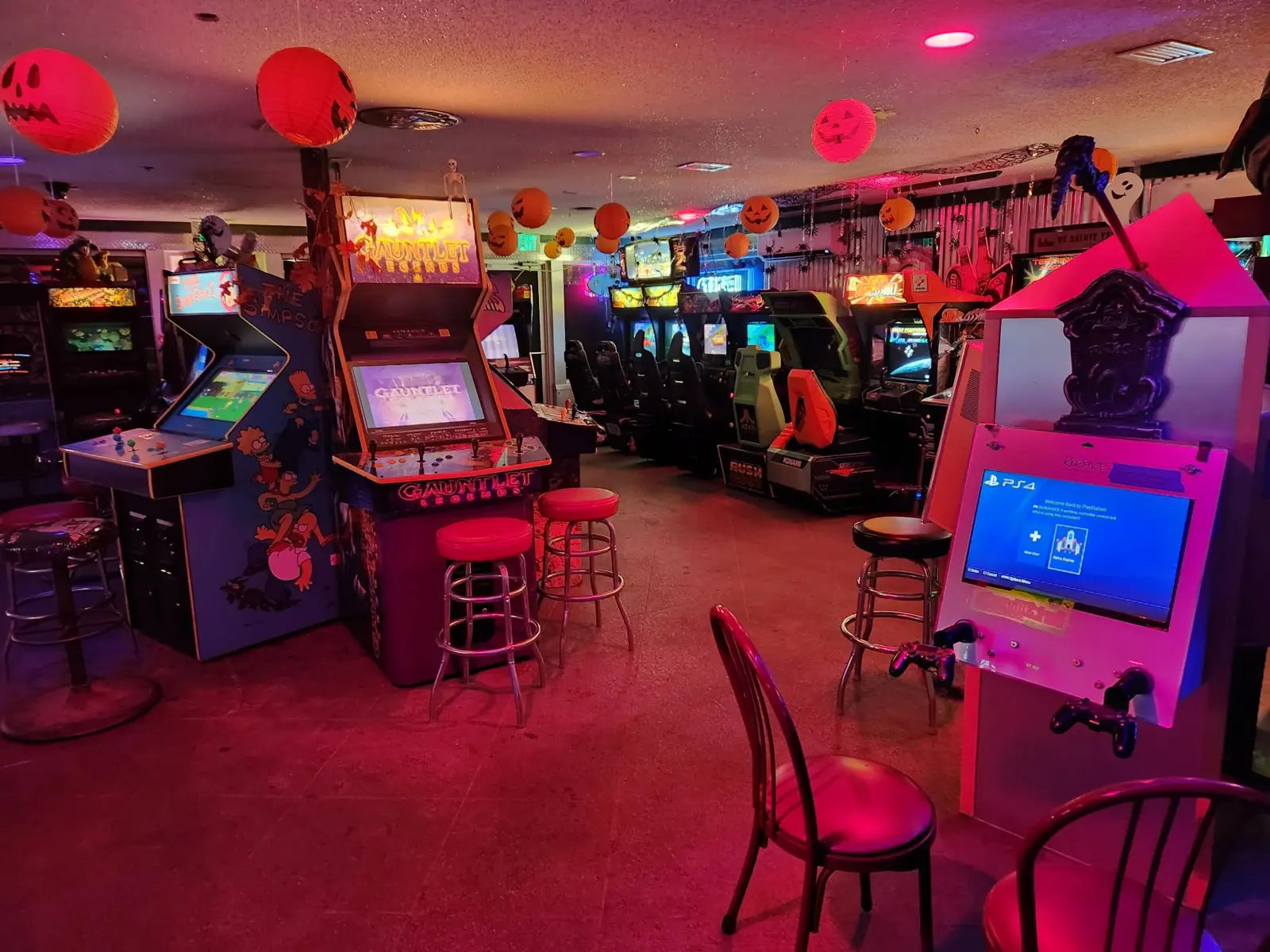PS4 kiosk beside Gauntlet Legends and The Simpsons